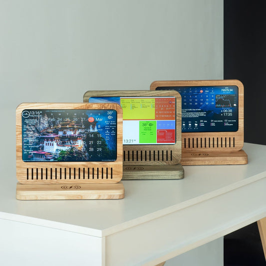 DAKBoard on table with clock and photo gallery